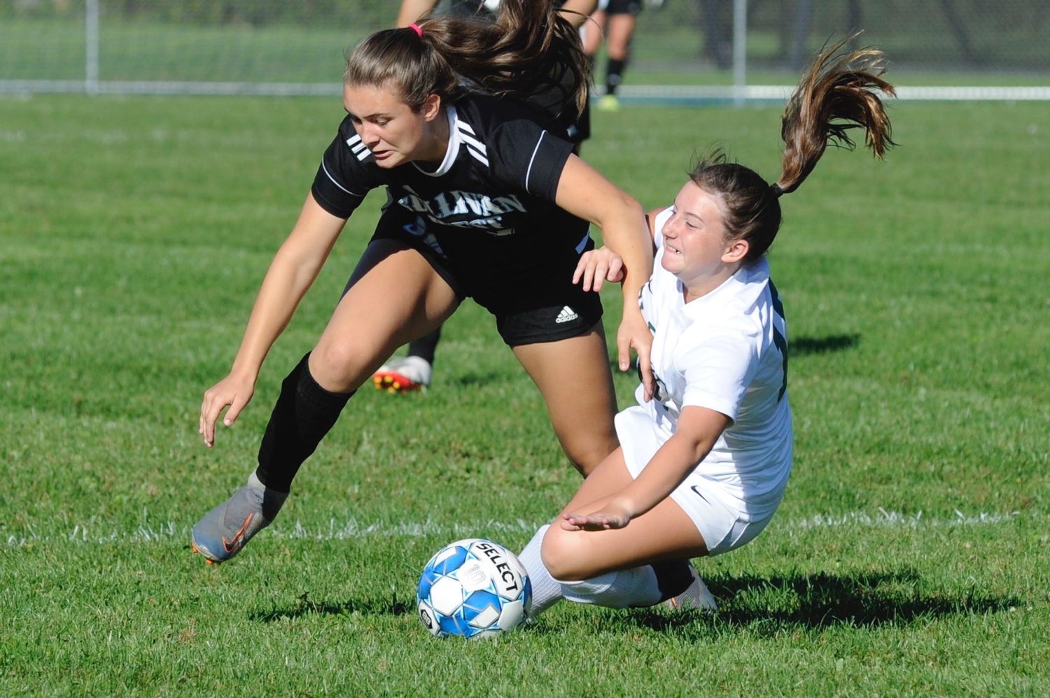 Collision course. Sullivan West’s Felicity Baurenfeind and Eldred’s Avery Moscatiello give it their all.